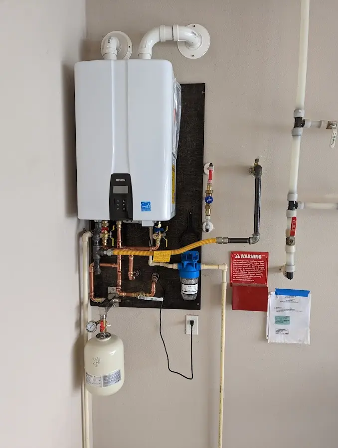 Professional plumber installing copper piping in a Baraboo home